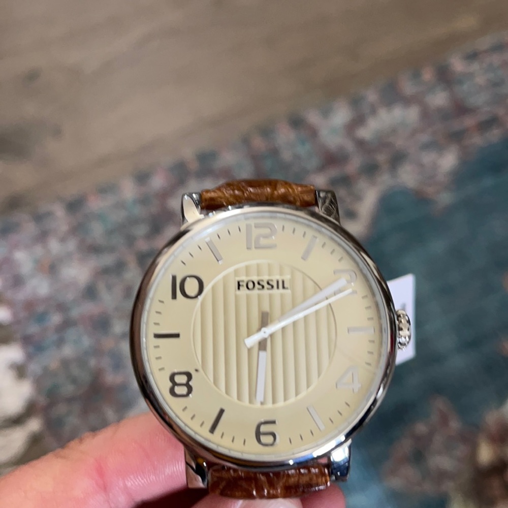 Women’s Fossil watch, silver face, leather band